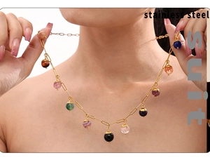 Detail showing colorful natural stone pendants on a gold stainless steel chain
