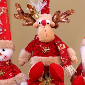 Close-up of Christmas plush dolls featuring a reindeer, snowman, and Santa with red sequins