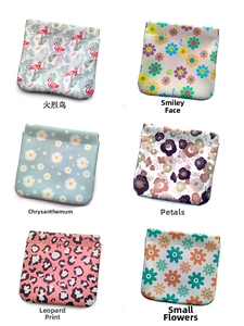 Six waterproof PU makeup bags with diverse floral and animal prints and metal snap closures