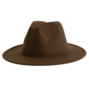 Detailed close-up of dark brown wool felt fedora showing the texture and indented crown