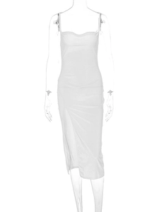 Detailed view of white camisole dress featuring a high side slit and minimalist design