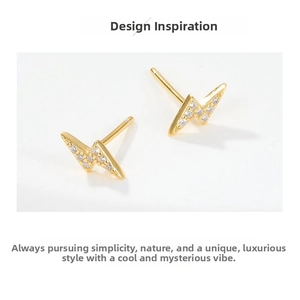 Macro shot of gold lightning bolt earrings with sparkling pave-set cubic zirconia