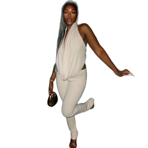 Chic beige halter neck draped top and slim fit pants two-piece set for women