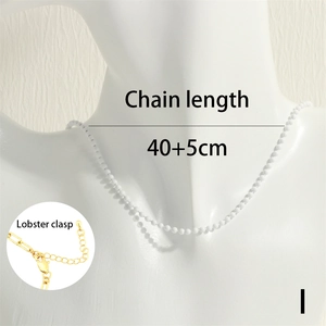Detailed view of white beaded necklace on mannequin showing 40+5cm length with lobster clasp