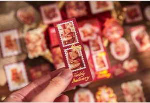 Detail of vintage teddy bear stickers with gold foil Teddy Delivery text and stamp design