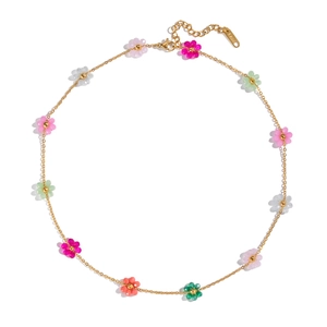 Detail showing colorful beaded flower necklace with gold stainless steel chain and clasp