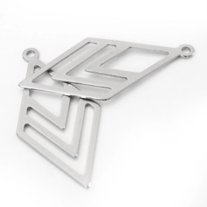 Macro view of silver diamond-shaped stainless steel charms with small top attachment holes