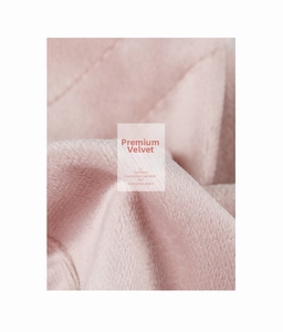Macro shot of high-quality pink velvet fabric with a soft brushed texture and natural sheen