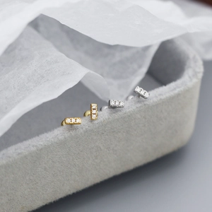 Sparkling 925 silver stud earrings with three zircons in gold and silver finish