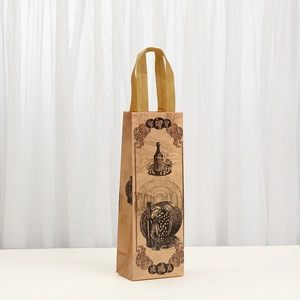 Detail of kraft paper wine bag with vintage print and sturdy woven ribbon handle