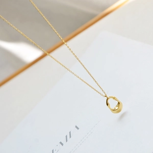 Minimalist gold necklace with irregular hollow waterdrop pendant on elegant thin chain