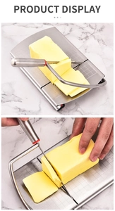 Close-up of stainless steel cheese slicer with precision scale grid on base