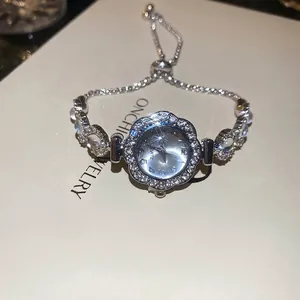 Elegant sunflower silver quartz watch with shimmering rhinestones and adjustable strap