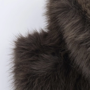 Detailed close-up showing the dense texture and fluffy fibers of dark brown faux fur vest