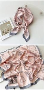 Detail of pink and grey silk square scarf with paisley pattern and soft textures