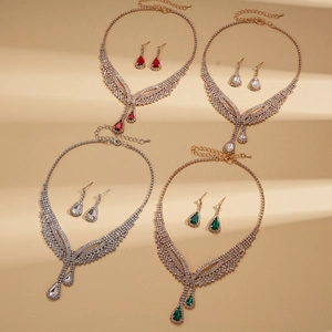 Elegant V-shaped bridal jewelry sets with teardrop crystals in gold and silver plating