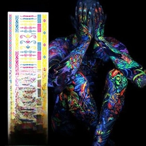 Glow-in-the-dark temporary tattoos showing EDM-style patterns under UV blacklight