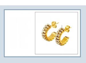Detail of C-shaped stainless steel earrings with 18K gold plating and double row rhinestones