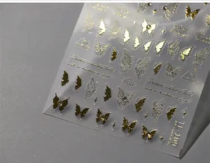 Macro detail of 3D embossed gold butterfly nail stickers with rhinestones style TL-109