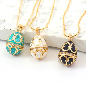 Fabergé-style egg pendant necklaces in blue, white and black enamel with gold-plated chains