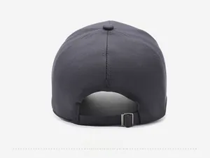 Close-up of dark grey baseball cap back with adjustable metal buckle and twill fabric