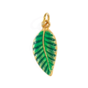 Detail view of leaf-shaped gold-framed charm with vibrant green enamel inlay for jewelry