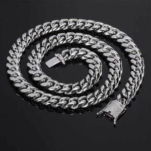 Detail of 12mm silver Cuban link chain featuring a sparkling rhinestone-set clasp