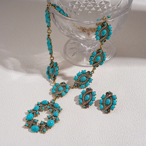 Parure de bijoux vintage bohème avec pierres turquoises et cristaux étincelants