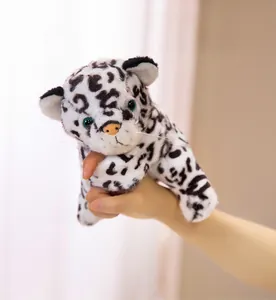 Close-up of a cute snow leopard plush slap bracelet held in hand with soft textures
