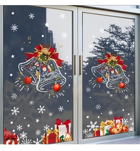 Detail of Christmas window stickers with red bells, reindeer and white snowflakes