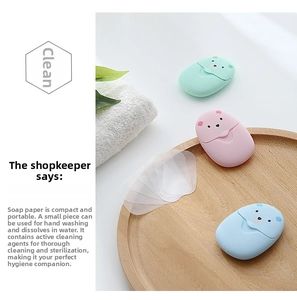 Macro view of portable mini bear soap paper cases in pastel pink, green, and blue