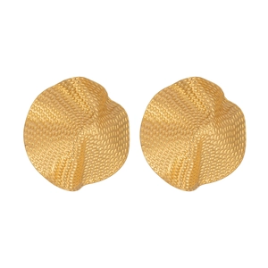 Detail of gold ruffle earrings with hammered metal texture and wavy geometric pattern