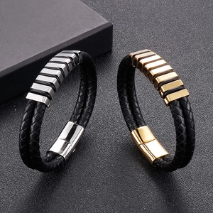Detailed close-up of double-layer braided leather bracelets with gold and silver magnetic clasps