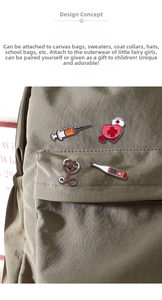 Detail of four medical enamel pins featuring a stethoscope and syringe on a canvas backpack