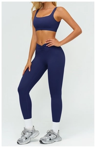 Detailed view of deep blue high-waist yoga leggings with V-shaped ruched waistband
