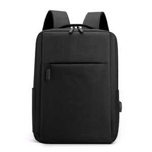 Waterproof black business travel backpack with USB charging port for professional commute