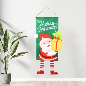 Hanging Merry Christmas banner with Santa Claus holding gifts against a white wall