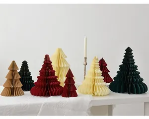 Close-up of multicolored honeycomb paper Christmas trees in various sizes for table decor
