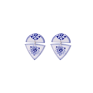 Detail of blue and white geometric acrylic earrings with porcelain pattern textures
