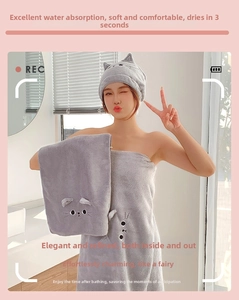 Close-up of coral fleece hair towel set with cute cat ear design and embroidery