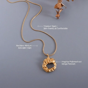 Irregular textured cutout pendant necklace in 18k gold plated titanium steel with extension chain