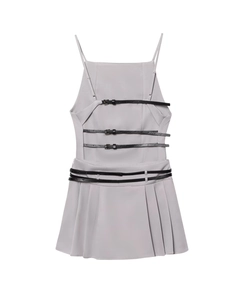 Detail view of grey pleated dress featuring three parallel black leather buckle straps on back