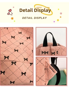 Detail view of pink corduroy backpack fabric with black bow patterns and side pocket