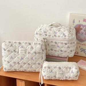 Three-piece white quilted makeup bag set with cute elephant print and today mood labels