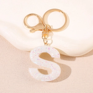 Porte-clés lettre S en résine blanche avec paillettes colorées et fermoir doré chic