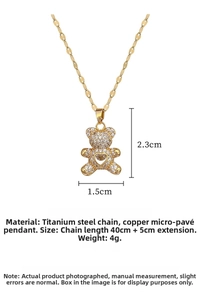 Detailed view of titanium steel bear necklace with cubic zirconia heart pendant