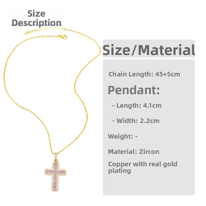 Detail of gold cross pendant with purple and white zircon crystals on a fine link chain