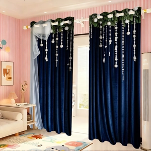 Deep blue velvet curtain detail featuring festive greenery and pearl pendant top decor