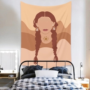 Detail of bohemian wall tapestry with minimalist female illustration and warm sun motifs