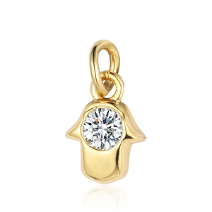 Detail of a golden Hamsa Hand pendant with a sparkling zircon stone for DIY jewelry
